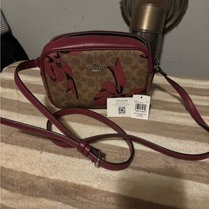 Coach Brown Signature Canvas Crossbody with Red Floral Accents